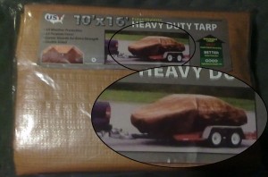 The photo on the unopened tarp package is of a wrapped up car